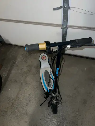 Color: Black with blue accents Charger included Twist-grip throttle and hand-operated front brake Fo...