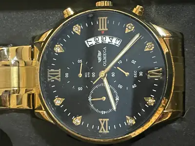 For sale $40 Olmeca Men's 0826M Analog Watch Gold Tone Never worn. New battery With box and slipcase