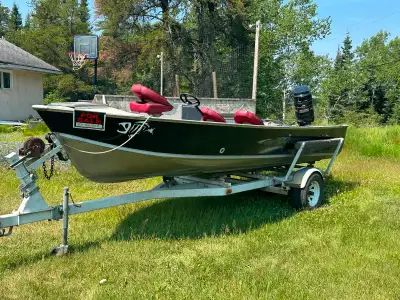 18’ Lund Mr. Pike with a 115 Mercury outboard and homemade trailer. Boat and motor are a 1984. Boat...