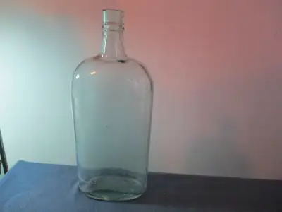 Probably a 40 oz. bottle, there are no labels & nothing etched to indicate name of maker. There is a...