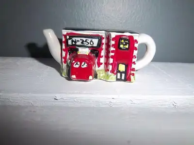 Red Rose Collectible mini Firehall teapot. Asking $15.00 OBO