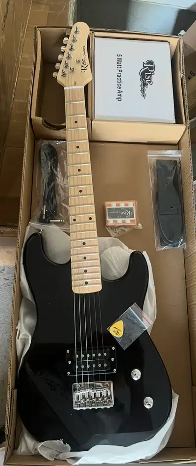 Brand new 3/4 electric Guitar combo Comes with strap amp picks and cable Brand new Perfect for kids