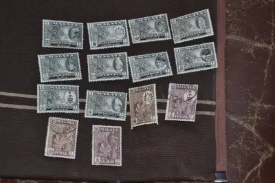 Stamps: Malaya States. 14 M&U stamps. $2.