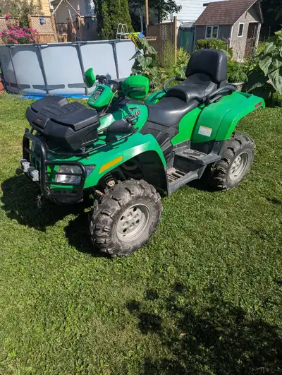This pre-owned Arctic Cat 650 TRV offers reliable performance and comfort for your trail adventures...