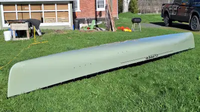 18.5 ft Fiberglass canoe. 2 stern seats. Stern foot brace. Adjustable bow seat. Contour yoke. Has ce...