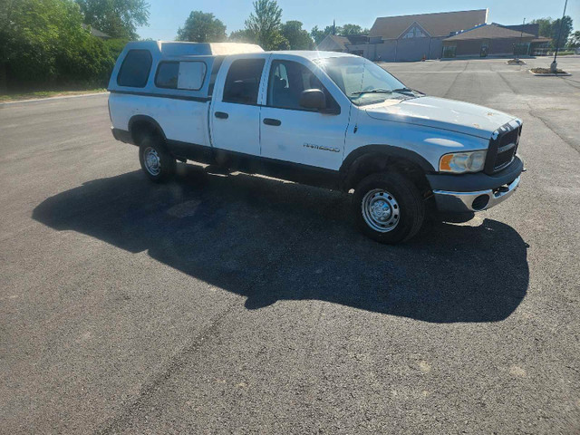 **Dodge Ram 2500 5.9 diesel 4x4 long box crew cab topper in Cars & Trucks in St. Catharines