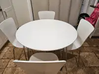 White wooden table and 6 chairs for sale