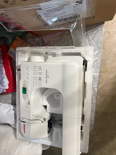 Janome sewing machine used for a few small projects and put back in the box. Mint condition.