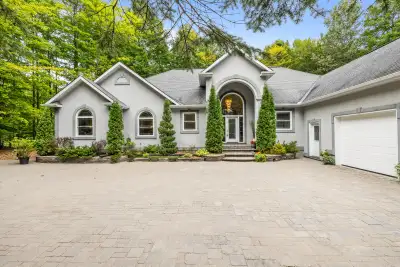 Welcome to 5732 Queenscourt Crescent, a distinguished custom-built estate set on 2.24 acres in prest...