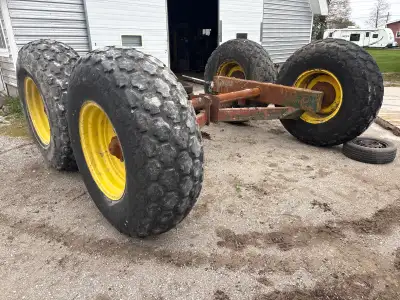 Nuhn Industries axle taken from manure spreader Axle, rims and tires
