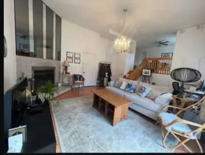 Rarely available executive townhouse in Chomedey offering approximately 1,600 sq. ft. with soaring c...