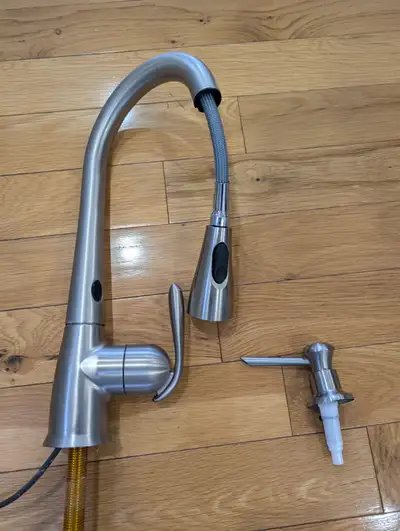 Stainless steel finish Moen kitchen faucet. Includes pull down head with stream and spray modes. Inc...