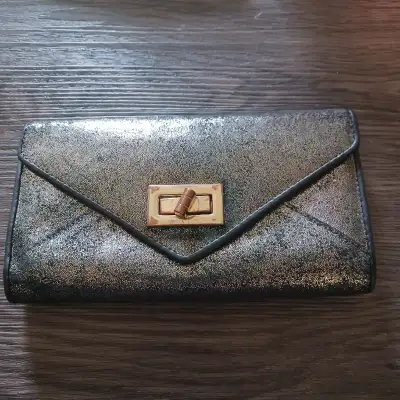 Danier Ladies Leather Wallet Dark brown leather with shiny gold overlay. Brass metal accents Metal c...
