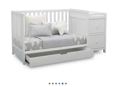 I'm selling a Delta Ultimate 4-in-1 Convertible Crib with Changing Table in Bianca White. This versa...