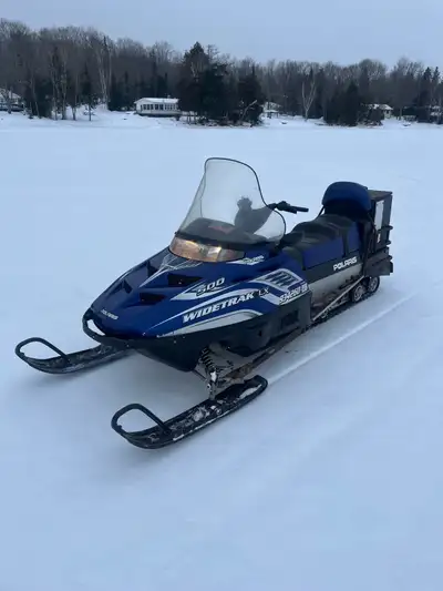 2004 Polaris wide track 500cc has hi low reverse transmission 4000$ also has a 1999 skidoo wide trac...