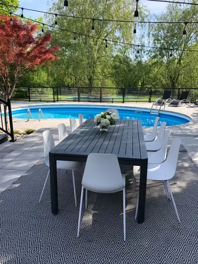 Modern outdoor table. 8’ long extends to 12’ Made from rust free aluminum. Originally from crate and...