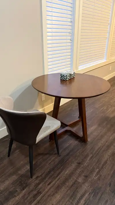 Small wooden round table, barely used., View more