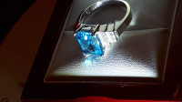 Solid white gold ring stamped 14K . Size 6.. Swiss blue topaz