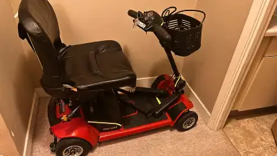 Go Go Ultra 4 wheel Mobility Scooter with armrests -In good condition -Red in colour -Battery was re...