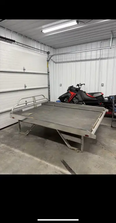 7ft aluminum sled deck, comes with a 2 piece 10ft ramp. Plywood is 2 years old