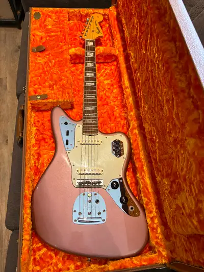 2012 Fender American 50th Anniversary Jaguar in Metallic Burgundy Mist. The guitar is in excellent c...