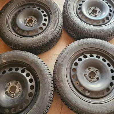selling four 17 inch Continental winter with VW OEM steel rims for $900. two tires are 90% of tread...
