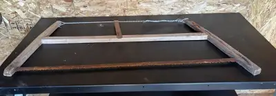 This is an antique bow saw, a classic tool for any woodworking enthusiast. It features a wooden fram...