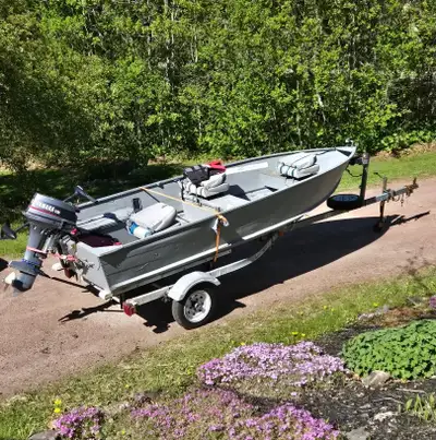 Princecraft Fisherman 14 foot aluminum boat with 15 HP Yamaha two stroke outboard. -Boat in good con...
