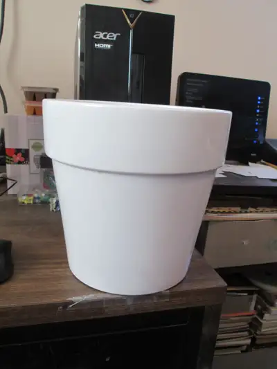ceramic flower pot (white - 8 inches tall). asking $4. if interested call or text me at 705 559 6493...