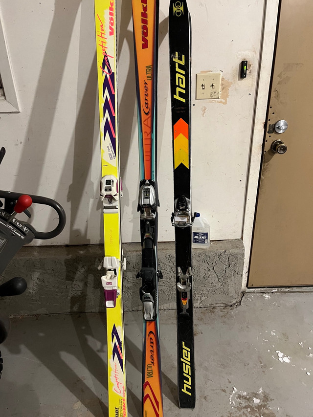 Three sets of skis helmet and goggles  in Ski in Lethbridge