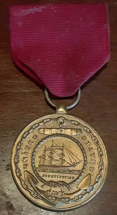 Although the medal itself had not changed since 1884, in 1961 a ring suspension for the ribbon and m...