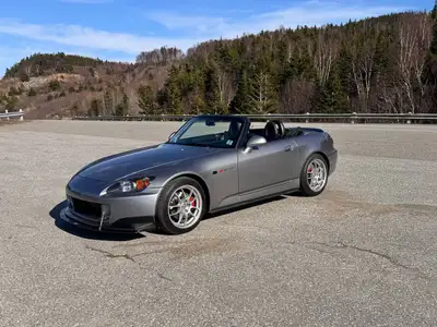 A legendary Honda RWD sports car. This Supercharged 2005 Honda S2000 in Silverstone Metallic and Bla...
