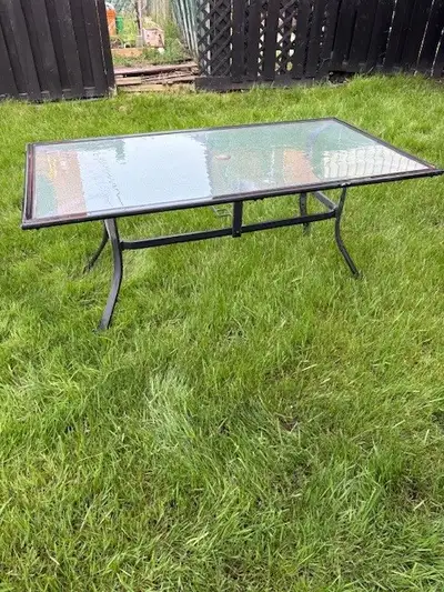 Patio Lawn Set- Glass ornamental table with six chairs. Table in excellent condition. The chairs are...