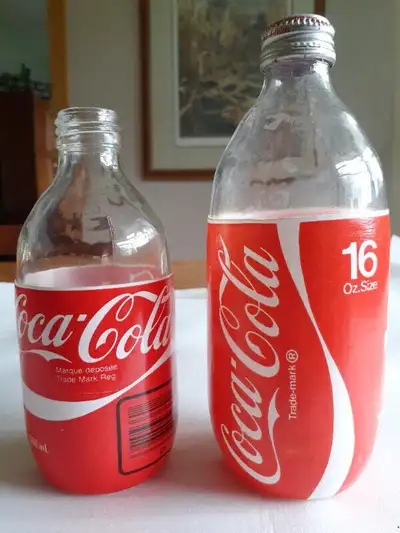 Two Stubby Glass Coke Bottles, View more
