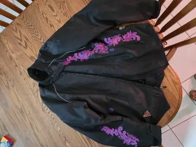 Women's motorcycle cordura jacket has elbow, shoulder and back padding. Says 2 XL but fits more like...