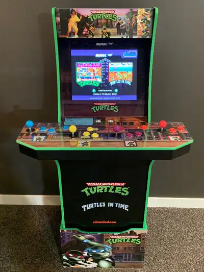Pick up only, no trades. Barely used, like new TMNT arcade 1up cabinet(includes riser). See pictures...