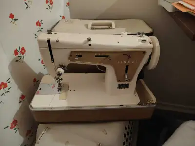 2 older singer sewing machines ( no power cords), View more