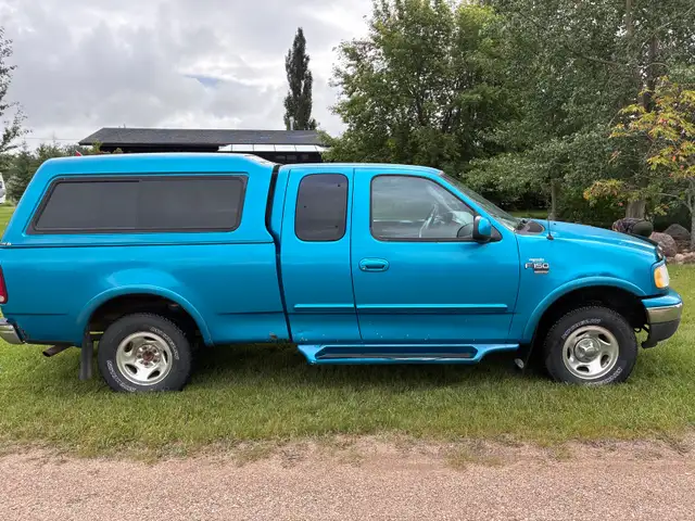 1999 Ford F150 4x4 Supercab 6.5’ box  2021 mid-rise canopy bed 