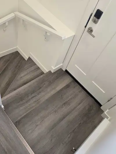 Newly built 1-bedroom, 1-bathroom legal suite features modern finishes, durable laminate flooring, a...