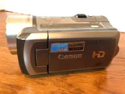 Several video cameras for sale. PHOTO 1: Canon Vixia HF100: $180 FIRM PHOTO 2: SOLD Panasonic HDC-TM...