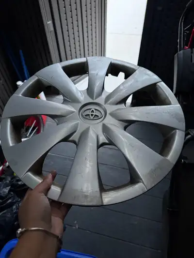 Genuine Toyota hubcap. Silver colour. Some scuffs and dirt from use. Fits 15-inch wheels. These are...