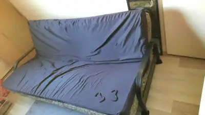 Black frame Queen size Futon. In great condition. No damage. L76.5 x W33 Selling for $90.00 obo