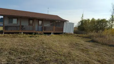 Seize the opportunity to own a home on 2 lots of .45 acres each, with some trees, conveniently locat...
