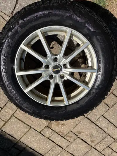 Beautiful 5 bolt alloy rims on 235x 65 R17 Bridgestone winter tires