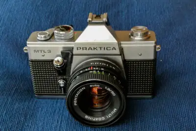 Practical MTL3 35 mm SLR film camera and 2 broken DSLRs w/ lens, View more