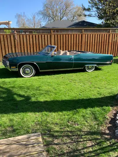 Experience classic American luxury with this 1970 Buick Electra 225 convertible in a stunning deep g...