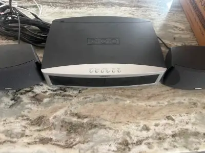 Bose Media Center (DVD/CD player/MP3) with sub-woofer. Surround sound speakers (2 front and 1 subwoo...