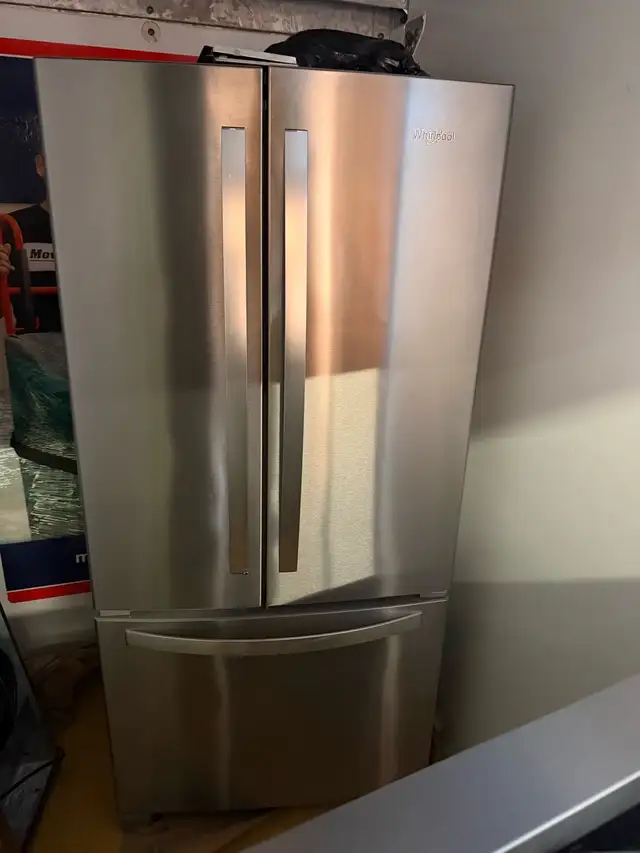Stainless Whirlpool Fridge /Stove and range .