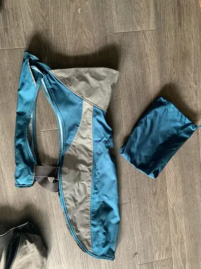 This large dog raincoat is designed to keep your furry friend dry and comfortable during wet weather...