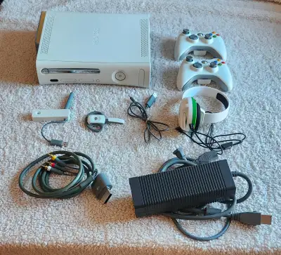 Awesome Modded Xbox 360 bundle. Has the console, two wireless controllers, wireless network adapter,...